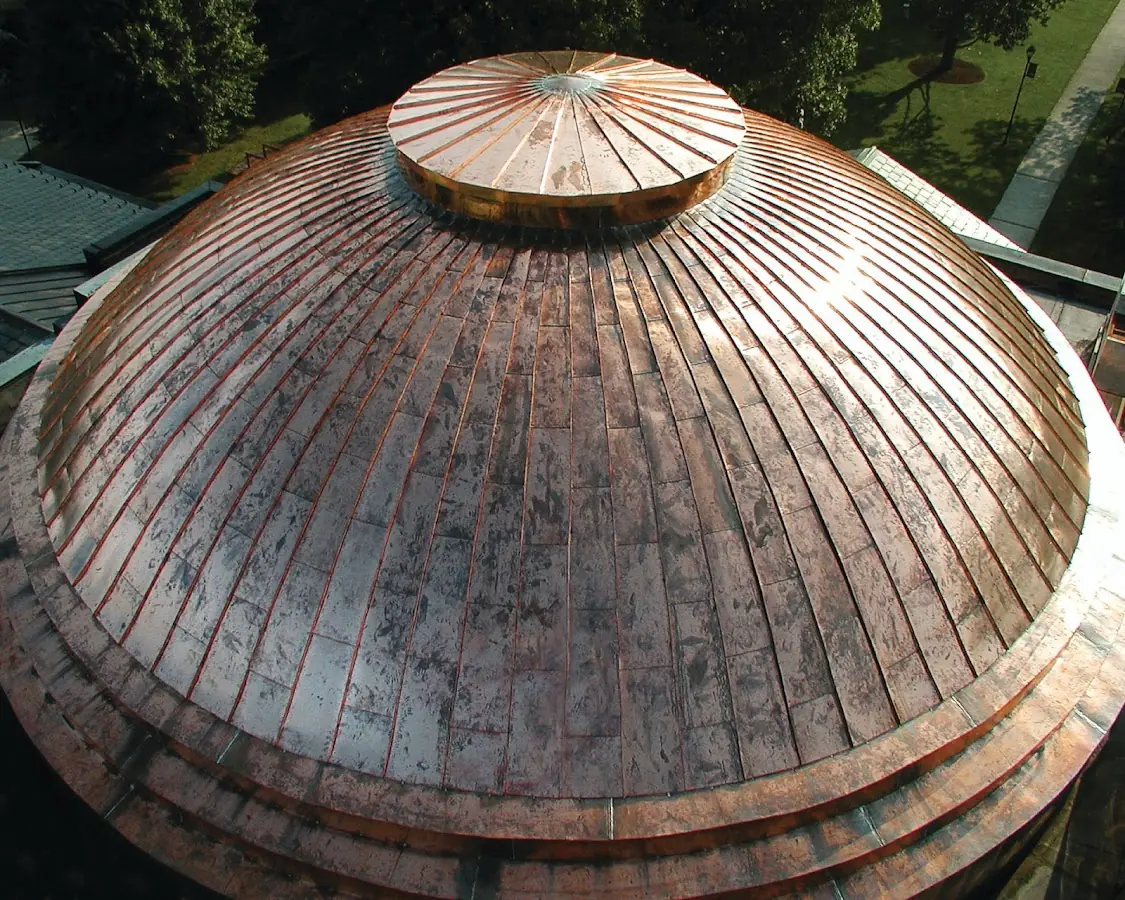 Craftsman Roofing crew installing a new roof in Camden